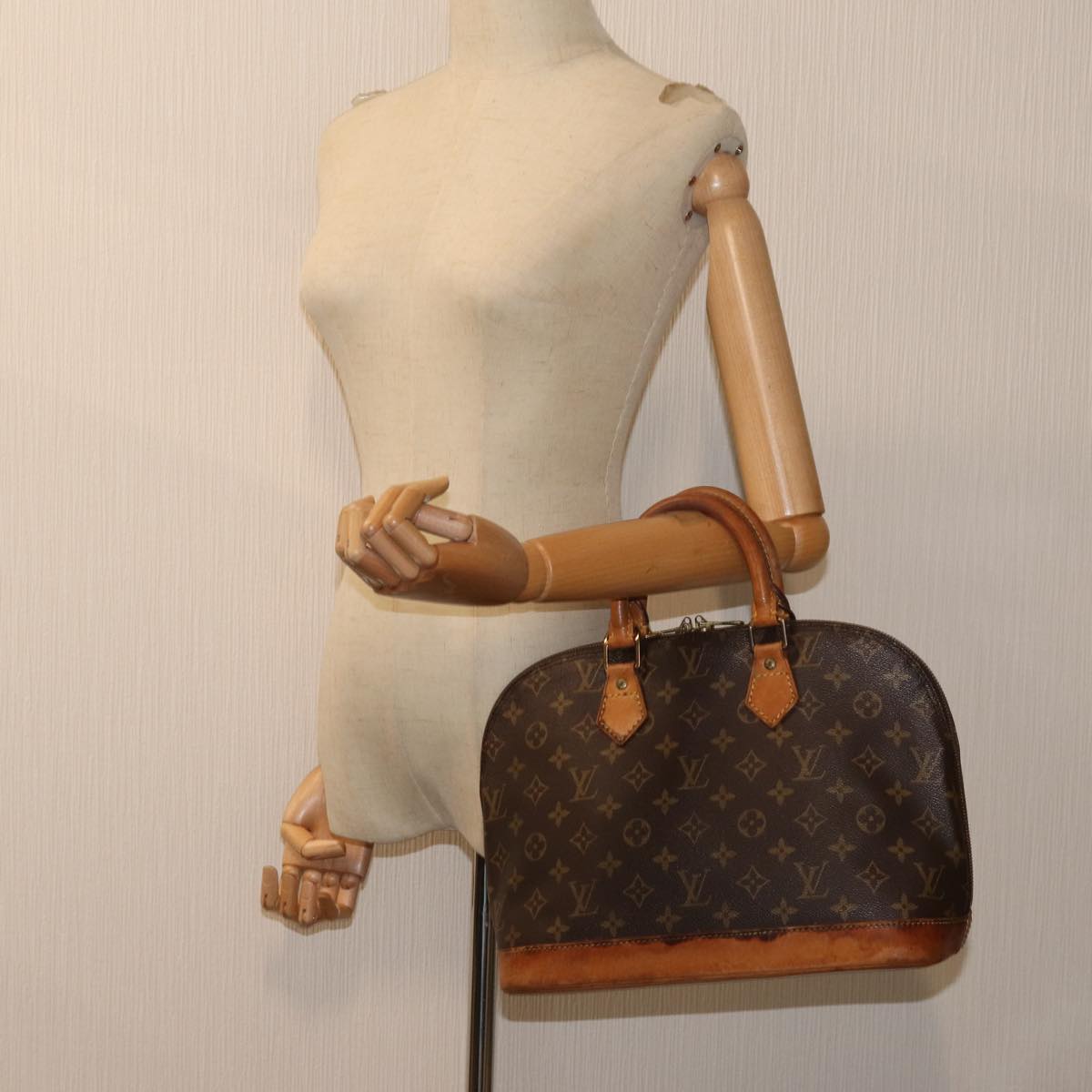 LOUIS VUITTON Alma Handbag