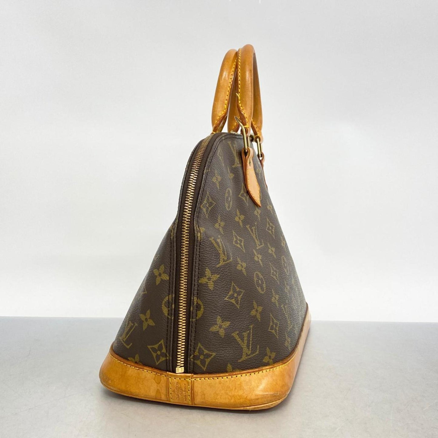 LOUIS VUITTON Alma Handbag