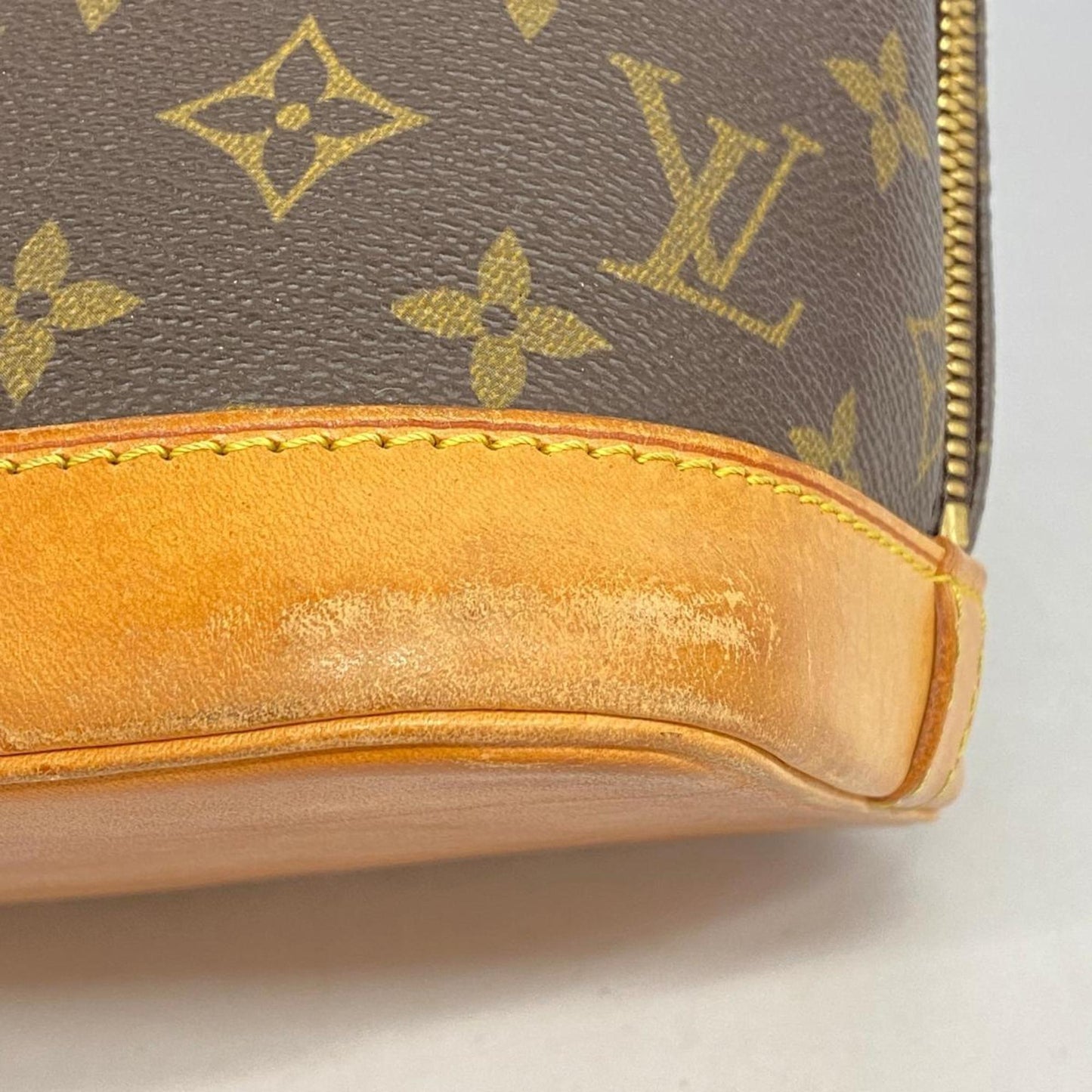 LOUIS VUITTON Alma Handbag