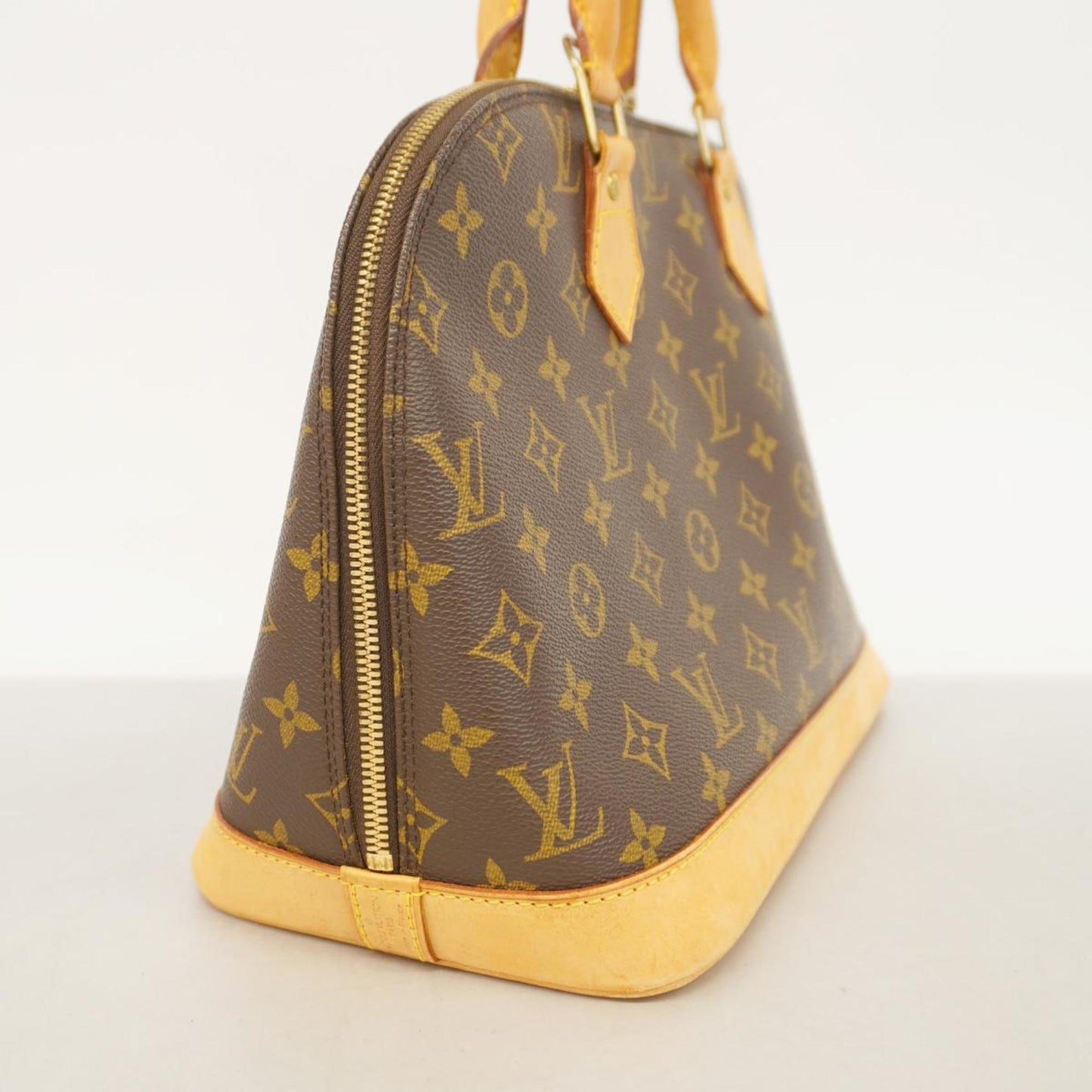 LOUIS VUITTON Alma Handbag