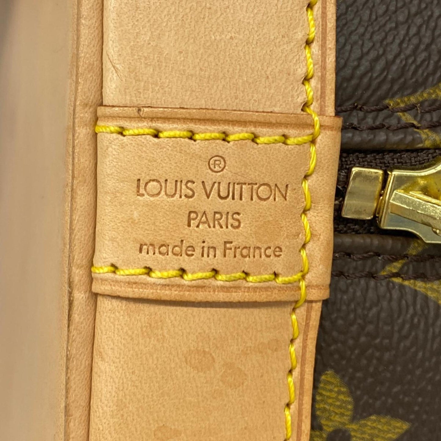 LOUIS VUITTON Alma Handbag