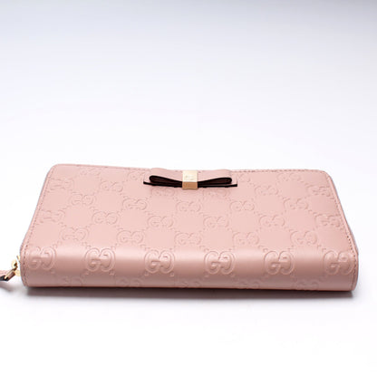 388680 Bow Zip Around Wallet Guccissima