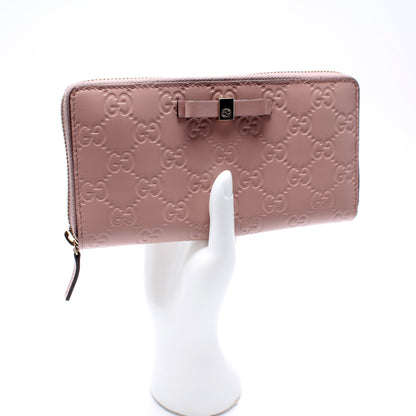 388680 Bow Zip Around Wallet Guccissima