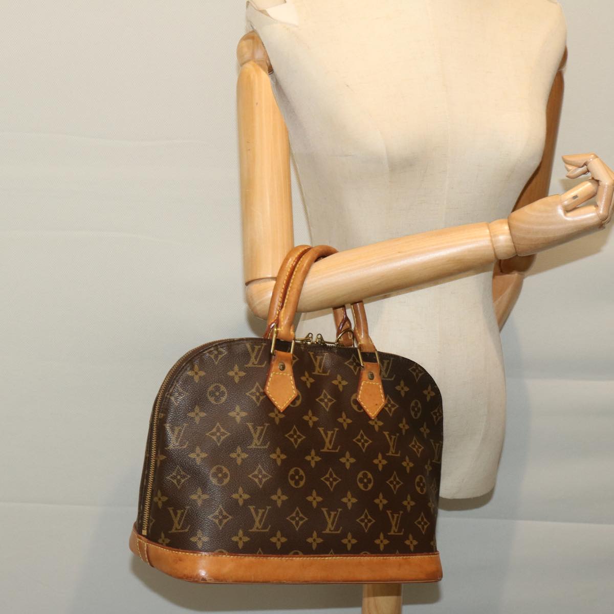 LOUIS VUITTON Alma Handbag