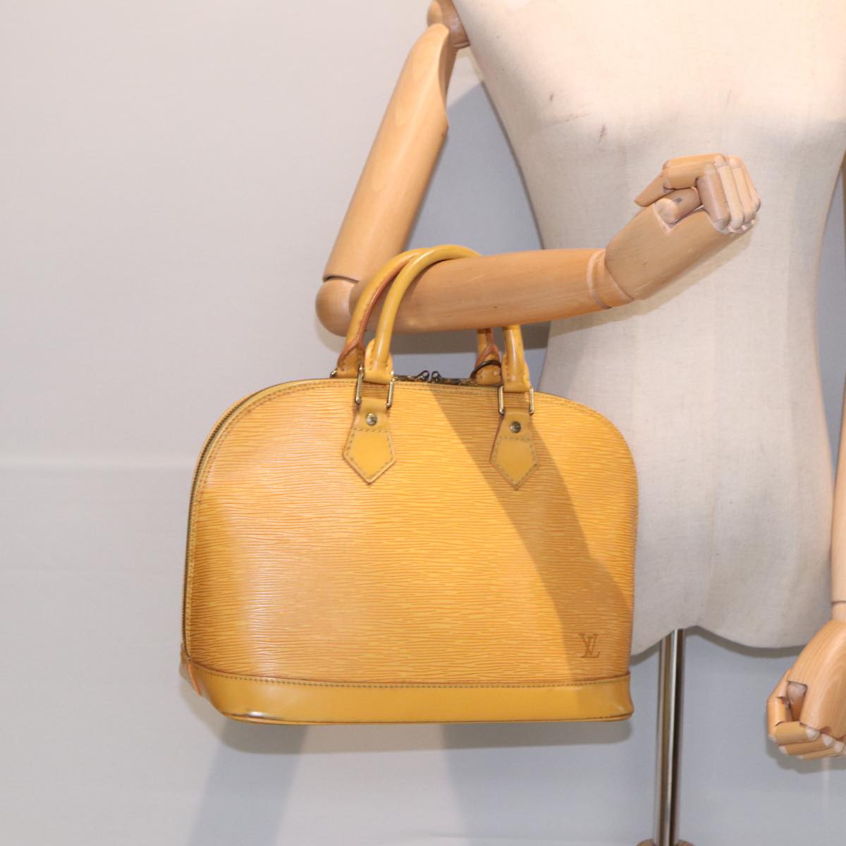 LOUIS VUITTON Alma Handbag