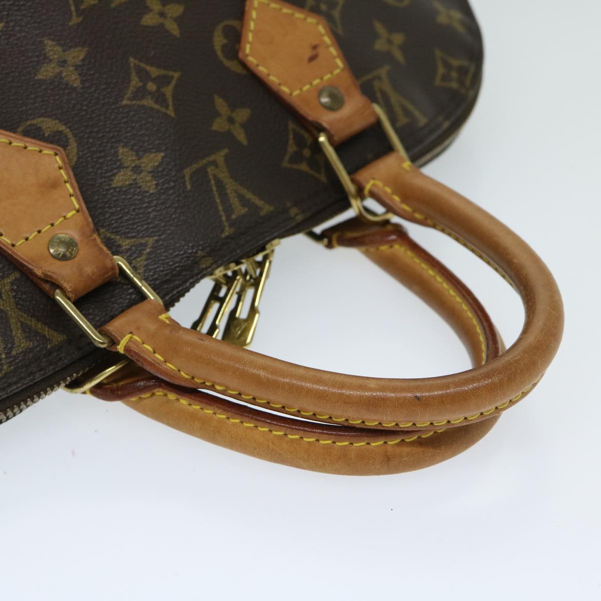 LOUIS VUITTON Alma Handbag