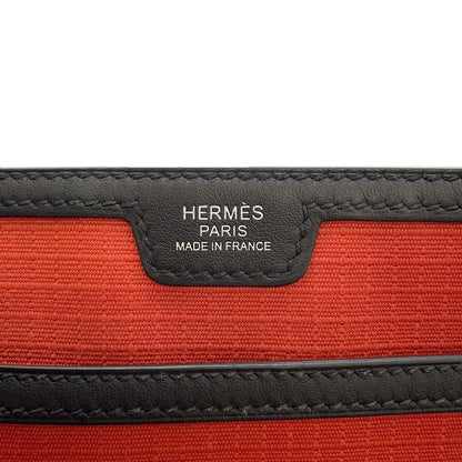 HERMES Messenger Slicked Back Capucines/Black Swift Leather Toile Bivouac