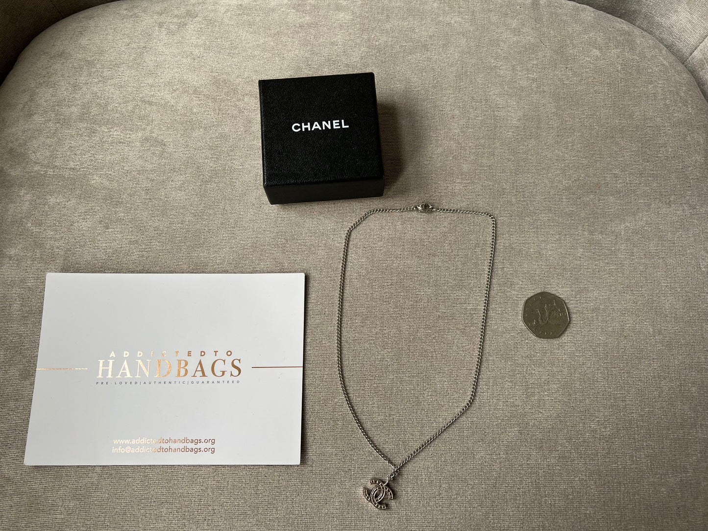 Chanel Silver Toned Embossed CC Pendant Necklace